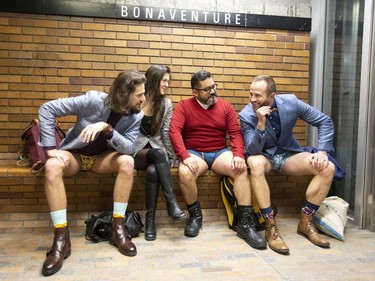 Participants in the annual No Pants métro ride wait on the platform in Montreal on Sunday, Jan. 12, 2020.  (