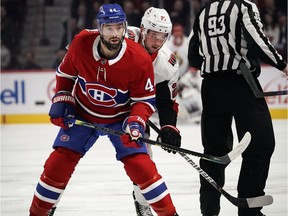 The Canadiens’ Nate Thompson and the Ottawa Senators’ Logan Brown keep their eyes on the play during NHL game at the Bell Centre in Montreal on Dec. 11, 2019.