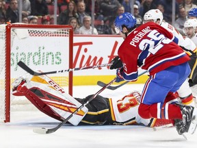 Montreal Canadiens Ryan Poehling fires the puck past Calgary Flames goalie David Rittich for his first goal of the season during third period of National Hockey League game in Montreal Monday January 13, 2020.
