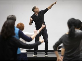 Choreographer Sylvain Emard helps amateur dancers who were recruited on Saturday to participate in his creation Le Petit Continental.