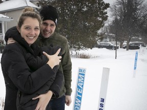 Dexter Church and Alanna Roszkowski with their four week old daughter Emma on Sunday Jan. 12. Their snow clearing business scrambled over the holidays after competitor Bo Pelouse went out of business.