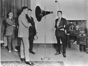 Heavyweight champion Jack Dempsey speaks into the microphone of a Marconi YC3 unit at CFCF in 1922, the year the station started using those call letters.