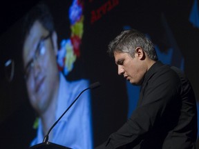 Armin Morattab pauses as he speaks of his brother Arvin during a tribute in Montreal on Sunday, Jan. 19, 2020, to commemorate victims of the jet shot down by Iranian missiles. Morattab's  twin brother, Arvin, as well as Arvin's wife, Aida Farzaneh, were killed while they were passengers in the jet that was attacked.