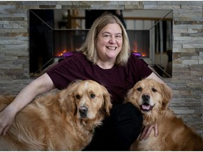 Author Donna Santini poses with family dogs Cooper and Harper. Cooper is the central character in her first children's book.