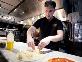 Federico Bianchi of Del Fornaio prepares pizza during a tour for the media and food bloggers of Le Cathcart  in Place Ville Marie on Wednesday, Jan. 15, 2020.