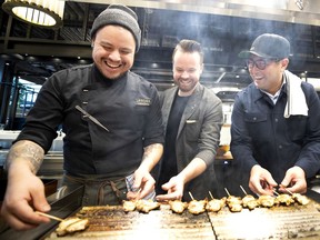 Carlos Gomez, left, Olivier Vigneault and Antonio Park get cooking at the Akio cantina in Le Cathcart, Montreal’s newest food hall.