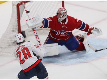 Montreal Canadiens goaltender Carey Price makes stick save on shot by Washington Capitals' Brendan Leipsic (28) in Montreal on Monday January 27, 2020.