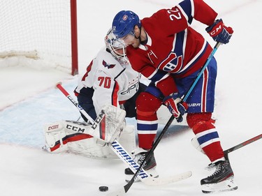 Montreal Canadiens' Dale Weise (22) lets go of puck as he scores on Washington Capitals goaltender Braden Holtby.