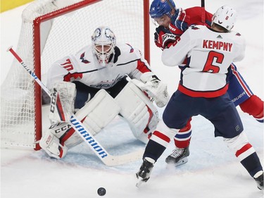 Montreal Canadiens' Nick Suzuki (14) is blocked by Washington Capitals' Michal Kempny (6), as he tries to get to loose puck in front of goaltender Braden Holtby, during third period NHL action in Montreal on Monday January 27, 2020.