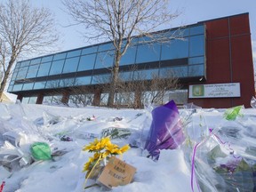 Floral and other tributes remain in the areas around the Centre Culturel Islamique de Québec in Quebec City, Thursday February 2, 2017. "No words or actions can bring back the lives of the husbands, fathers, brothers, uncles, human beings stolen from their families. We can, however, continue to speak up against hate toward Muslims and all other minorities," Fariha Naqvi-Mohamed writes.