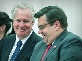 Former premier Jean Charest (left) and former Montreal mayor Denis Coderre, seen here in 2017, are both thought likely to re-join the political fray this year.