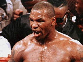 Boxer Mike Tyson reacts after being disqualified at the end of the third round of his title fight with WBA heavyweight champion Evander Holyfield in Las Vegas 28 June, 1997, for biting Holyfield's ear.