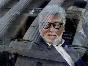 Seen in May 2019, Gilbert Rozon looks out from a vehicle after leaving the Quebec Court of Appeal in Montreal.
