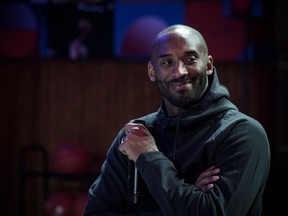 Former NBA basketball player Kobe Bryant attends a promotional event organized by the sports brand Nike, for the inauguration of the infrastructure improvements of a local basketball playground at the Jean-Jaures sports hall Le Quartier in Paris on Oct. 21, 2017.