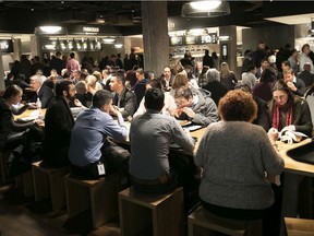 Customers enjoy their food at Time Out Market on Thursday November 14, 2019.