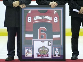A framed jersey belonging to the late Tristan Morrissette-Perkins is shown during a ceremony to retire his No. 6 at the Dorval arena on Nov. 19, 2017. His family has established a scholarship in his memory.