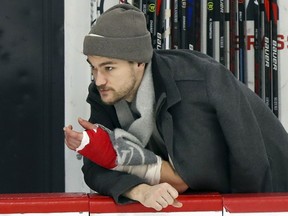 Injured Montreal Canadien Jonathan Drouin watches practice at the Bell Sports Complex in Brossard on Nov. 27, 2019.