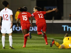 MANCHESTER, ENGLAND - APRIL 05:  Christine Sinclair of Canada (12) celebrates as she  1scores her team's first goal during the International Friendly between England Women and Canada Women at The Academy Stadium on April 05, 2019 in Manchester, England. (Photo by Clive Brunskill/Getty Images) ORG XMIT: 775319072