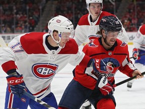 Capitals' Brendan Leipsic  and Canadiens' Brett Kulak battle for the puck at Capital One Arena on Nov. 15, 2019, in Washington, D.C. Montreal won the game 5-2.