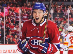 Canadiens' Nick Suzuki scores against the Flames to tie the game and force overtime at Scotiabank Saddledome on Dec. 19, 2019, in Calgary.