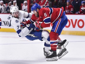 Shea Weber #6 of the Montreal Canadiens takes down Anthony Cirelli #71 of the Tampa Bay Lightning during the first period at the Bell Centre on January 2, 2020 in Montreal.