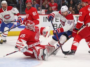 Wings goalie Jonathan Bernier makes a first- period on Canadiens' Tomas Tatar at the Little Caesars Arena in Detroit Tuesday night.