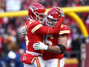 Kansas City Chiefs quarterback Patrick Mahomes hugs right-guard Laurent Duvernay-Tardif of Montreal after a touchdown in the fourth quarter against the Tennessee Titans in the AFC Championship Game at Arrowhead Stadium on Jan. 19, 2020, in Kansas City, Missouri.