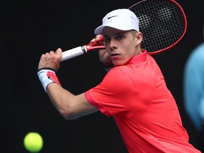 Denis Shapovalov of Canada plays a backhand during his Men's Singles first round match against Marton Fucsovics of Hungary on day one of the 2020 Australian Open at Melbourne Park on Sunday, Jan. 20, 2020, in Melbourne.