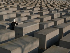 A visitor takes in the Memorial to the Murdered Jews of Europe in Berlin, ahead of Holocaust Remembrance Day and the 75th anniversary of the liberation of the Auschwitz-Birkenau extermination camp on Jan. 27.
