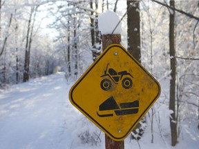 Snowmobiles and ATV share the same paths in the winter.