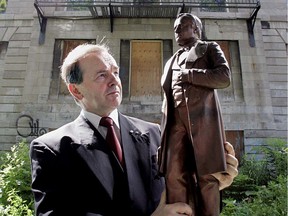 Senator Serge Joyal with a model of Louis Hippolyte Lafontaine in 2006.