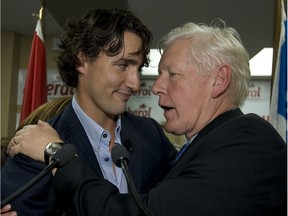 Bob Rae and Justin Trudeau (L) sharea hug following Trudeau's speech in his ridding office in Papineau on September 24, 2008.