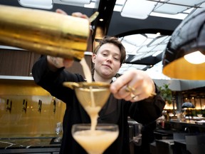 Daphnée Vary Deshaies mixes cocktails during a tour for the media and food bloggers at the renovated food court at Place Ville Marie in Montreal, on Wednesday, January 15, 2020.