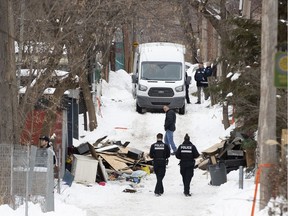 Montreal police investigate a fire in a garage where firefighters discovered the body of a female victim Jan. 23, 2020.