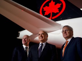 Air Canada's first A220 — the Airbus jet that Bombardier developed under the C Series name before relinquishing control of the program. From left: Alain Bellemare, CEO of Bombardier, Calin Rovinescu, CEO of Air Canada, and Christian Scherer, chief commercial officer.