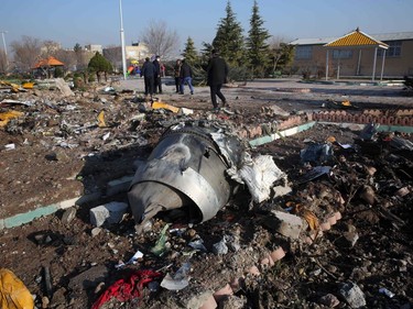 Rescue teams work amidst debris after a Ukrainian plane carrying 176 passengers crashed near Imam Khomeini airport in the Iranian capital Tehran early in the morning on January 8, 2020, killing everyone on board.
