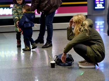 A women at the arrival gate of the Boryspil airport outside Kiev on January 8, 2020, after a Ukrainian airliner carrying 176 people from seven countries crashed shortly after takeoff from Tehran.