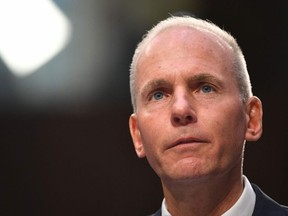 In this file photo taken on Oct. 29, 2019, Boeing President and Chief Executive Officer Dennis Muilenburg testifies before the Senate Committee on Commerce, Science, and Transportation on Aviation Safety and the Future of Boeings 737 MAX in the Hart Senate Office Building on Capitol Hill in Washington, D.C.