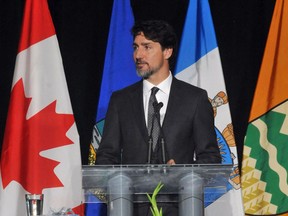 Prime Minister Justin Trudeau speaks at a memorial service for the victims of the Ukraine Airlines crash in Iran at the Saville Community Sports Centre in Edmonton on Sunday, Jan. 12.