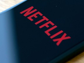 (FILES) In this file photo taken on July 10, 2019 the Netflix logo is seen on a phone in this photo illustration in Washington, DC. - Netflix said jANUARY 21, 2020 it added millions of new subscribers globally over the past quarter as it prepared up for a tougher competitive landscape, but scaled back its outlook for early 2020. The global television streaming giant beat expectations with a profit of $587 million in the fourth quarter of 2019 as revenue rose 31 percent from a year ago to $5.5 billion. (Photo by Alastair Pike / AFP) (Photo by ALASTAIR PIKE/AFP via Getty Images) ORG XMIT: USTR hear