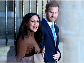 Britain's Prince Harry and his wife, Meghan, Duchess of Sussex, react as they leave after their visit to Canada House in London on Jan. 7, 2020.