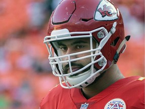 Kansas City Chiefs offensive lineman Laurent Duvernay-Tardif (76) is shown during pre-game warmups before an NFL preseason football game in Kansas City, Mo. Chiefs offensive lineman Laurent Duvernay-Tardif can finally put away the medical books for a while and spend all his free time studying up his playbook. Duvernay-Tardif graduated from McGill University's medical school on Tuesday, May 29, 2018.
