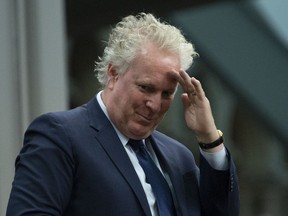 Former member of parliament and former Quebec premier Jean Charest stands as he is recognized by the Speaker of the House of Commons following Question Period, Monday, April 1, 2019 in Ottawa. Charest's decision to bow out of the Conservative leadership race marks a turning point in a contest expected to heat up throughout the week as the party prepares for the return of the House of Commons.THE CANADIAN PRESS/Adrian Wyld