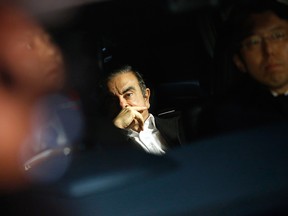 Carlos Ghosn, former chairman of Nissan Motor Co., center, sits in a vehicle as he leaves his lawyer's office in Tokyo, Japan, on Wednesday, March 6, 2019.