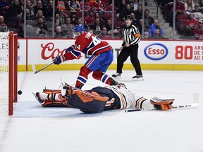 Canadiens forward Nate Thompson hits the inside of the post past Oilers goalie Mike Smith (41) during the second period Thursday night at the Bell Centre.