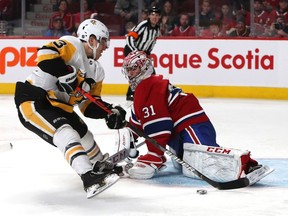 Canadiens goaltender Carey Price (31) makes a save against Pittsburgh Penguins left wing Brandon Tanev (13) during the first period at Bell Centre on Jan. 4, 2020.