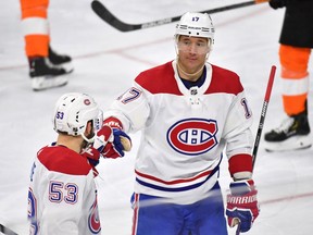 Montreal Canadiens' Ilya Kovalchuk  celebrates with Victor Mete after scoring against the Philadelphia Flyers during the third period in Philadelphia on Jan. 16, 2020.