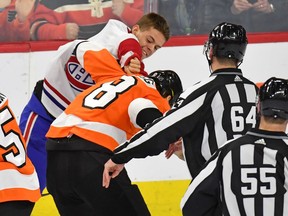 The Canadiens' Jesperi Kotkaniemi and the Flyers' Robert Hagg fight during the third period  at the Wells Fargo Center in Philadelphia on Jan. 16, 2020.