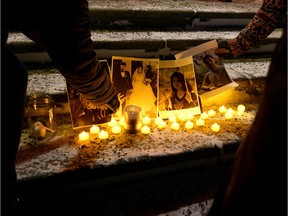 People attend a candlelight vigil held at the Edmonton Legislature building in memory of the victims of a Ukrainian passenger plane that crashed in Iran, in Edmonton, Alberta, Canada, January 8, 2020.