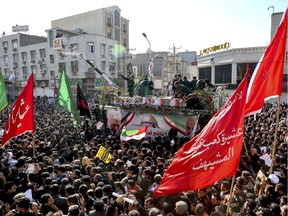 n this photo provided by The Iranian Students News Agency, ISNA, flag draped coffins of Gen. Qassem Soleimani and his comrades who were killed in Iraq in a U.S. drone strike, carried on a truck surrounded by mourners during their funeral in southwestern city of Ahvaz, Iran, Sunday, Jan. 5, 2020. The body of Soleimani arrived Sunday in Iran to throngs of mourners, as U.S. President Donald Trump threatened to bomb 52 sites in the Islamic Republic if Tehran retaliates by attacking Americans.